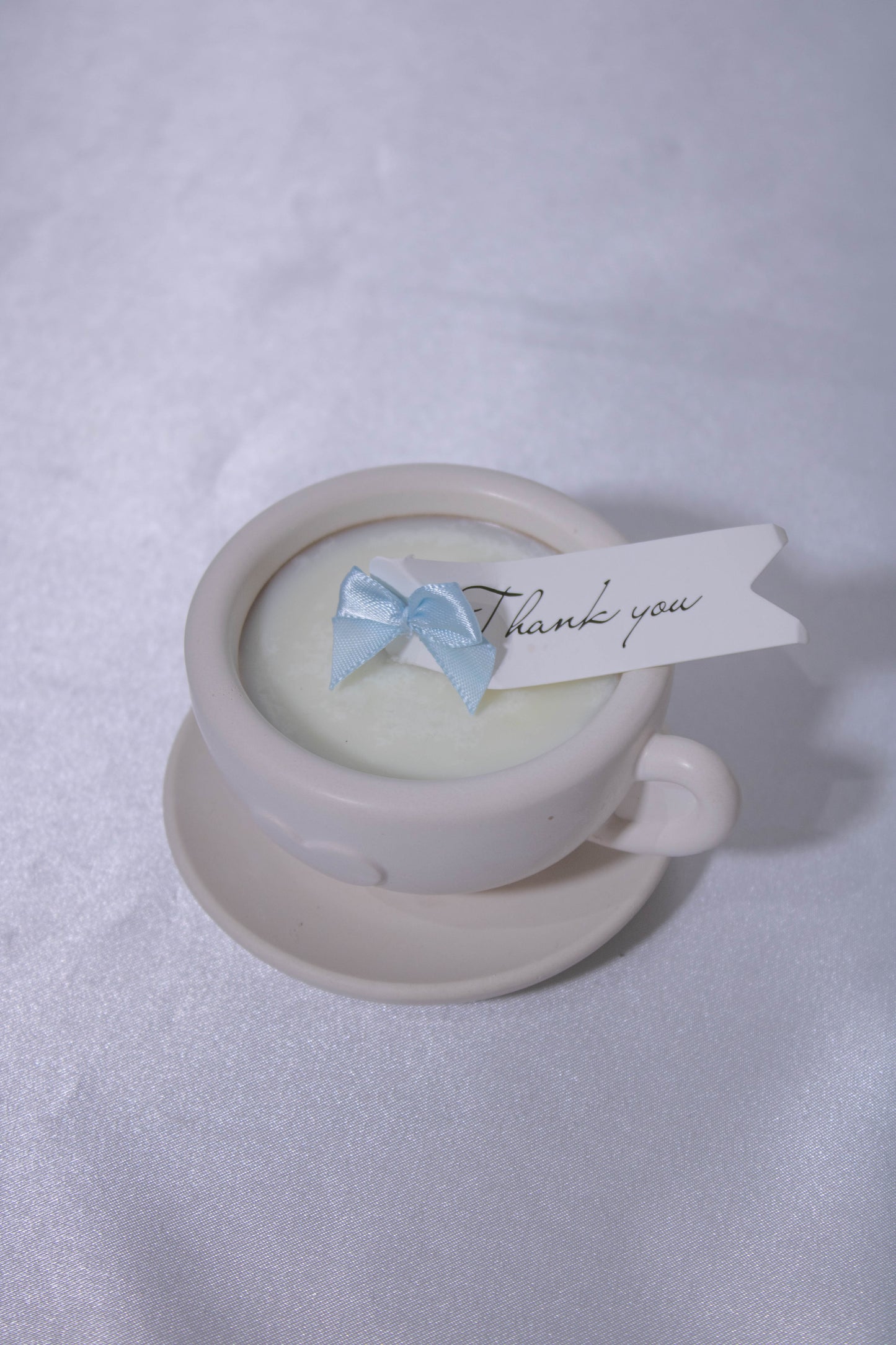 Vela taza